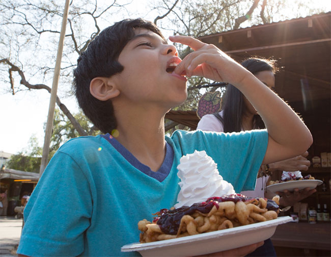 Boy-eating-a-funnel-cake 650px